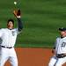 Tigers' third baseman Miguel Cabrera makes an out as Jhonny Peralta looks on in the first inning during Game 4 of the ALCS against the Yankees at Comerica Park in Detroit on Thursday. 